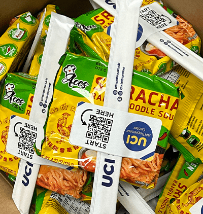 Bags of ramen noodles with UCI antrepreneur QR code