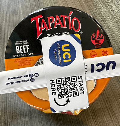 cup of tapatio ramen with UCI antrepreneur QR code